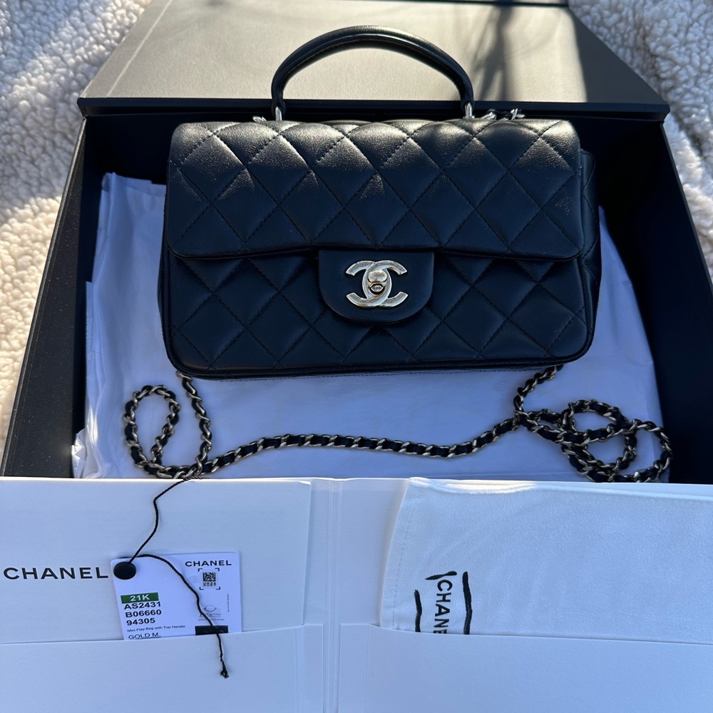 SOLD!!
Chanel rectangular flap with handle gold hardware